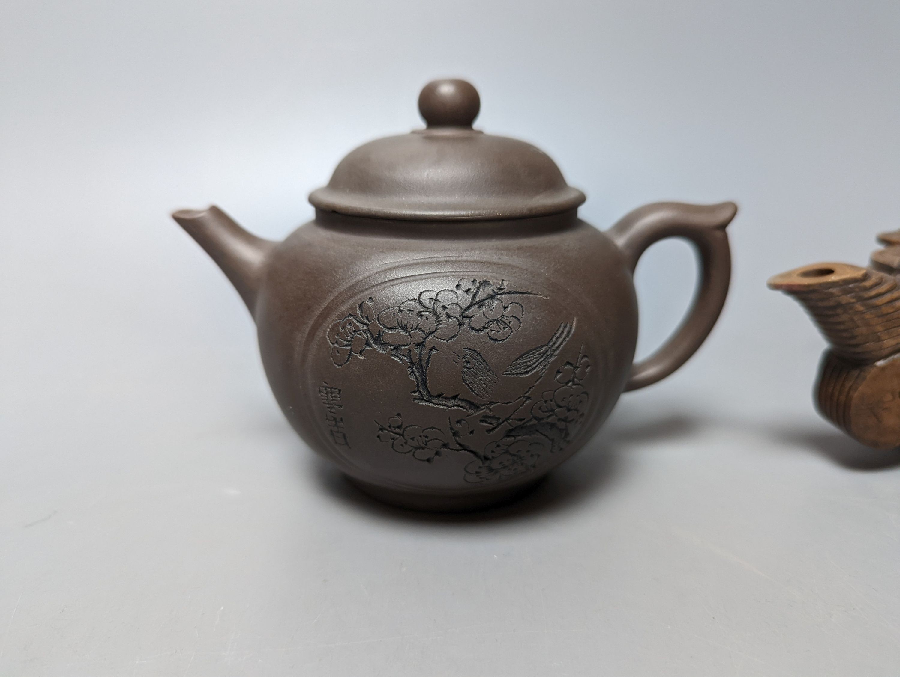 A Chinese stoneware 'cash' teapot and cover and five Yixing teapots (6)